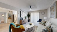 Located at 12821 Stratford Dr in Oklahoma City, this single-story, 1-bedroom, 1-bathroom residence offers a smartly organized layout with modern updates throughout. Light wood-style flooring flows continuously across the living spaces, creating a cohesive and airy feel. The living room is a comfortable gathering space, featuring a textured ceiling, a sleek pendant light fixture, and a sliding glass door with vertical blinds that welcomes natural light. It connects seamlessly to a dedicated dining area, which is anchored by a circular pendant light and offers room for a full dining set. The galley-style kitchen is well-equipped with two-tone grey and white cabinetry, white quartz countertops, a textured tile backsplash, stainless steel appliances, and a window that brings in additional natural light. The spacious primary bedroom accommodates a generous furniture arrangement and includes in-unit laundry, built-in shelving, and a bright window. The bathroom features a grey vanity with a light countertop, a framed mirror, and a full tub-shower combination. Throughout the home, neutral grey walls and consistent flooring provide a clean, modern backdrop ideal for a variety of décor styles.