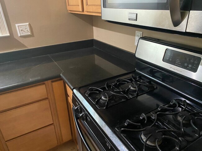 Kitchen counter with new gas stove - 114 Dewitt Ave