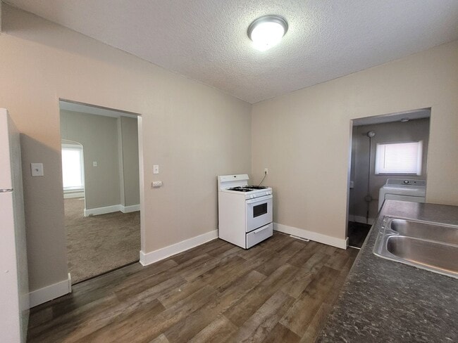 Building Photo - Two bedroom home with partially fenced yard!