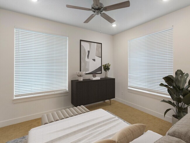 Dormitorio con ventilador de techo - The Atlas Apartments