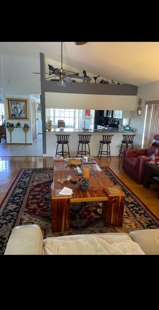 Living room view looking towards the kitchen and Island which has lowlights - 7639 Wells Ct