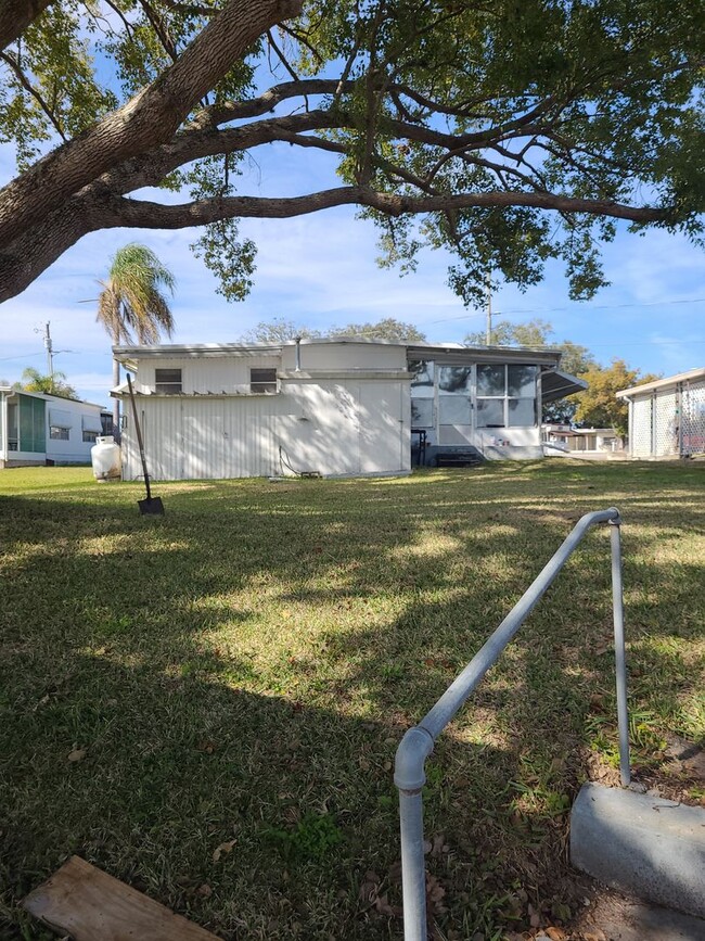 Building Photo - 55+ mobile home community. On canal to bea...