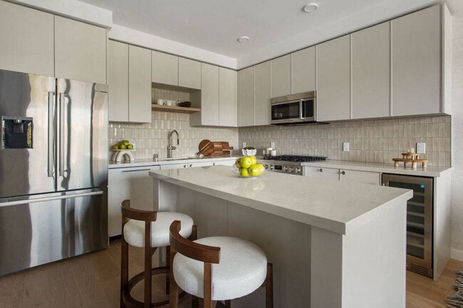 Kitchen w/ Island in a One Bedroom Apartment at Ten 310 in Los Angeles, CA. - Ten310