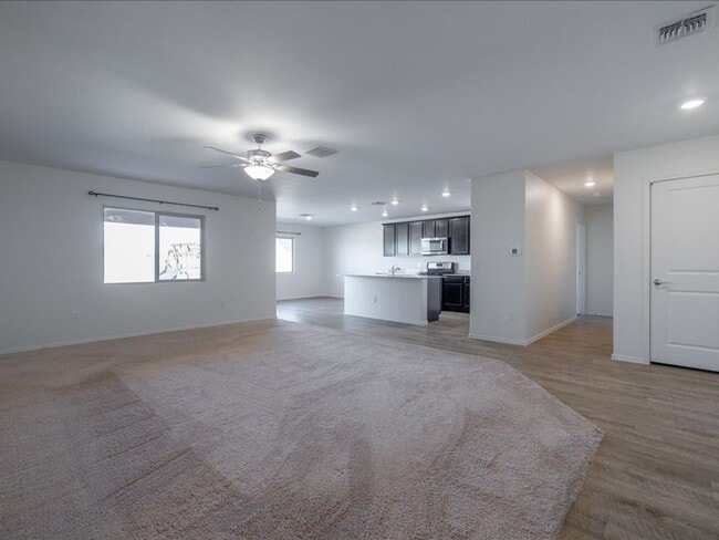 Building Photo - Spacious 4-Bedroom Home with Open Layout & Turf Backyard