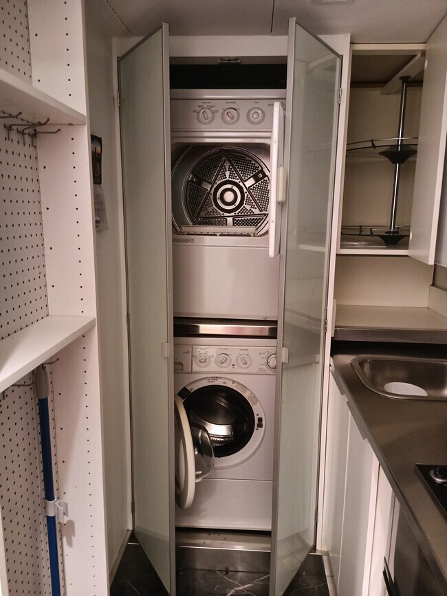 Washer dryer in kitchen - 11 E 128th St