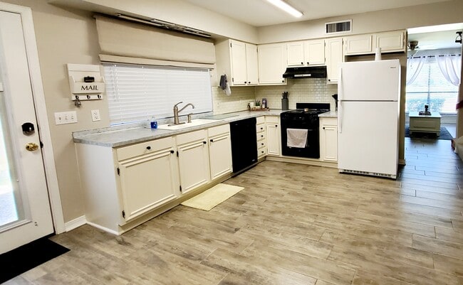 Large eat-in kitchen with large window for tons of natural light. - 10101 Hanover Dr