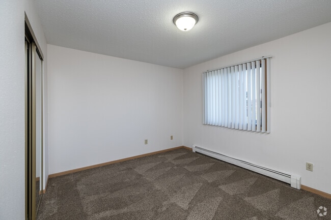 2BR, 1BA - 820SF - Primary Bedroom - Dakota View Estates