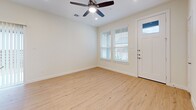 Located at 2750 Gathering Pl in Midlothian, TX, this single-story 2-bedroom, 2-bathroom home offers a thoughtfully designed layout with clean, modern finishes throughout. Light wood-tone flooring flows seamlessly across the living areas and bedrooms, creating a warm and cohesive aesthetic. The open-concept kitchen and living room serve as the heart of the home, where the kitchen impresses with crisp white shaker cabinets, a classic subway tile backsplash, stainless steel appliances, and a generous granite-topped island with an integrated sink — ideal for both meal prep and casual dining. The living area benefits from natural light through windows dressed with white blinds and is finished with a ceiling fan overhead. Both bedrooms are bright and inviting, each featuring the same light wood flooring, ceiling fans, and windows with blinds that allow for natural light. The primary bedroom includes a dedicated walk-in closet with built-in shelving for ample storage. The bathrooms are elegantly finished with large-format marble-look tile on both the floors and tub surrounds, paired with white vanities and illuminated mirrors, delivering a clean, spa-like atmosphere throughout.
