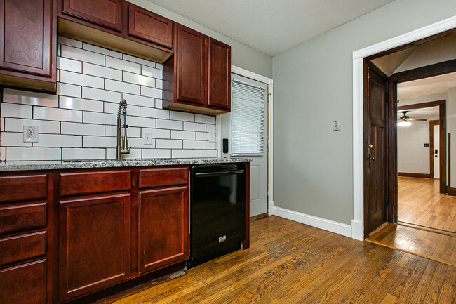 Kitchen with new backsplash, countertops and sink. - 348 N Algona St