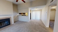 This 570 square foot, one-bedroom apartment in Amarillo, TX, offers a thoughtfully designed living space. The open-concept floor plan seamlessly integrates the living room and kitchen, creating a sense of spaciousness. The living area is anchored by a cozy fireplace, perfect for chilly evenings, and features large windows that flood the space with natural light.

The kitchen, visible through a pass-through window, boasts dark wood cabinetry, black appliances, and a granite countertop, providing both functionality and style. The bedroom, measuring 130 square feet, includes a sliding door closet for ample storage. The bathroom features a modern vanity with a granite countertop, complemented by a shower/tub combination and wood-look vinyl flooring.

Throughout the apartment, neutral-toned walls and carpeting create a versatile backdrop for various decor styles. The use of wood-look flooring in the kitchen and bathroom adds warmth and durability. Despite its compact size, the apartment's layout maximizes space efficiency, offering a comfortable living environment with all essential amenities in a single-story design.