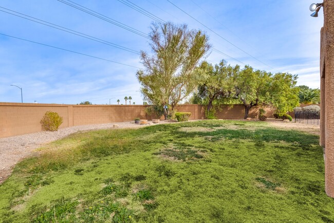 Building Photo - This 4-bedroom, 3-bathroom gem in a gated ...