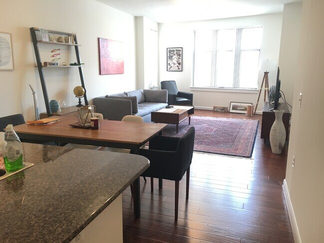 Large living area, dinning table area with hardwood flooring 2 bedroom condo for rent in DC - 400 Massachusetts Ave NW