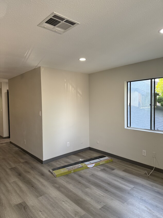 Open Living Room and Dinning Room. All new flooring, new carpets, and paint. - 1907 W Whitendale Ave