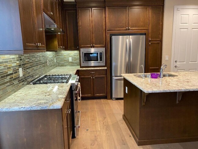 Building Photo - Impressive Two-Story, End Unit Townhome in...