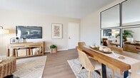 Located at 8100 Perry St in Overland Park, Kansas, this one-bedroom, one-bathroom residence offers a thoughtfully designed single-floor layout with efficient use of space throughout. The open-concept living and dining area serves as the heart of the home, featuring warm-toned luxury vinyl plank flooring, neutral walls, and a textured ceiling. Natural light fills the living room through a sliding glass door that opens onto a private balcony, offering pleasant outdoor views. The dining area accommodates a full dining set and flows seamlessly into the living space, making it ideal for everyday living and entertaining. The kitchen is equipped with white cabinetry, light countertops, and includes a dishwasher and range, with a window that brings in additional natural light. The spacious bedroom features a ceiling fan, multiple windows with blinds and curtain panels, and a closet with built-in shelving, providing ample storage. The full bathroom includes a tub/shower combination. Three closets throughout the unit offer generous storage options. Additional highlights include a dedicated laundry area and a utility room. The overall ambiance is bright, clean, and inviting, with a cohesive neutral palette that creates a warm and comfortable living environment.