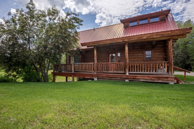 Building Photo - Charming Log Cabin and Carriage House – Do...