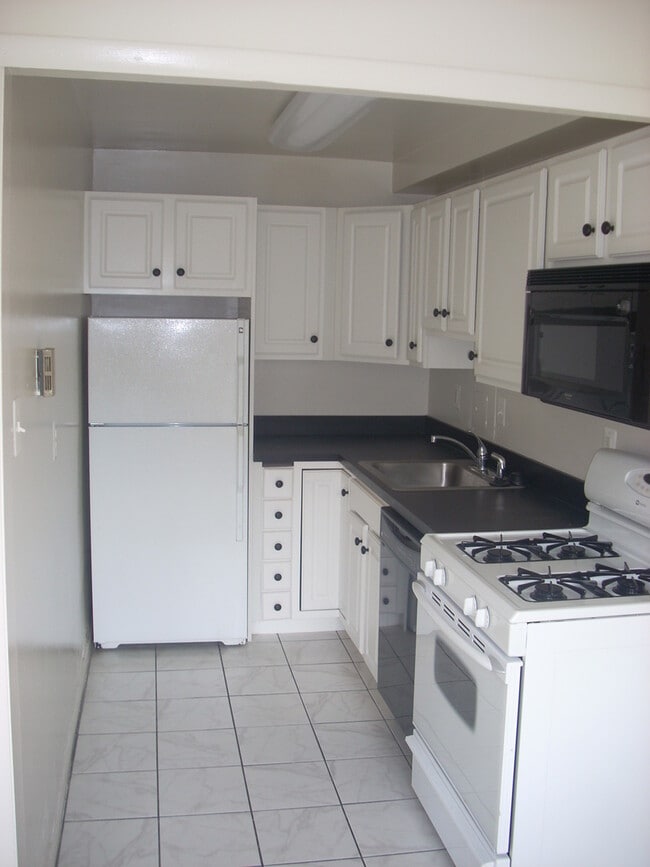 Building Photo - A renovated efficiency located on the four...