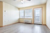 Located at 769 North Star Dr in Madison, WI, this one-bedroom, one-bathroom unit offers a well-organized single-floor layout with a practical and comfortable design throughout. Light hardwood-style flooring runs continuously across the living, kitchen, and bedroom areas, lending a clean, cohesive look to the entire space.

The kitchen is a standout feature, equipped with light wood cabinetry, black appliances including a refrigerator, electric range, and microwave, as well as a double-basin sink set into a peninsula with pendant lighting overhead. The peninsula provides both additional workspace and a natural division between the kitchen and the open living area, which benefits from a ceiling fan and a large window with views of the surrounding landscape.

The bedroom is generously sized for a one-bedroom unit, featuring light-toned walls, hardwood-style flooring, and a sliding-door closet with a built-in hanging rod for ample storage.

The bathroom is clean and functional, featuring a wood-toned vanity with a white countertop and a large mirror, accompanied by a full tub-shower combination unit. Warm neutral wall tones carry throughout, giving the space a consistent and inviting ambiance. A dedicated closet adds further storage convenience to the overall layout.
