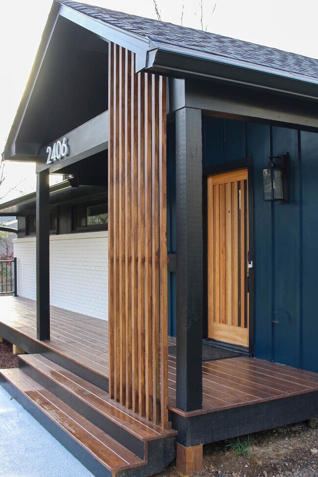Modern architectural design features accentuate the covered front porch. - 2406 Boswell Rd