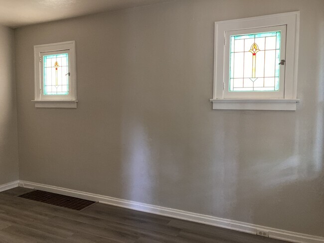 Living room with beautiful stain glass windows - 5374 Odell St