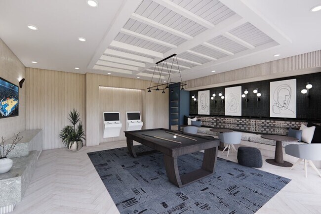 Desde juegos de arcade hasta billar y asientos de salón relajados, nuestro espacio de recreación elevado está diseñado para la conexión y el disfrute fácil. - The Residence Peninsula Apartments
