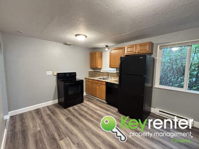 Foto del edificio - 4 Bedroom 2 Bathroom Tacoma Rental with Ga...