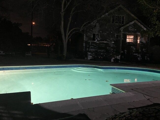 Pool and back of home at night - 5802 Melvin Ave