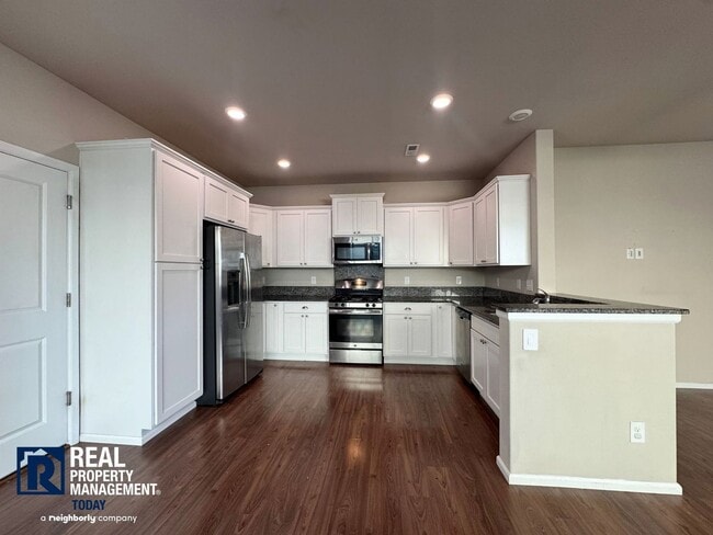 Building Photo - Spacious 4-Bedroom Home with Fenced Yard & 2-Car Garage Near JBLM!