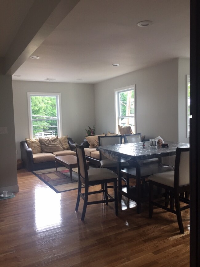 Large open living and dining area with natural light - 76 Eleanor St