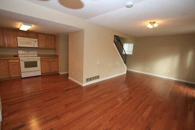 Building Photo - Deer Run attached home with yard, 2-car ga...