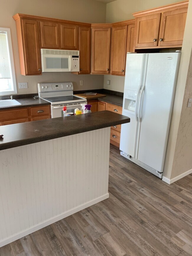 Kitchen with new flooring - N1166 Redwing Dr
