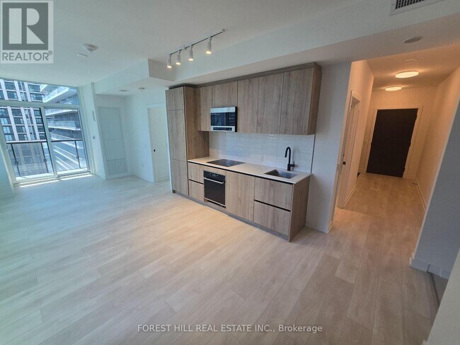 Photo du bâtiment - 117-1117 Broadway Ave
