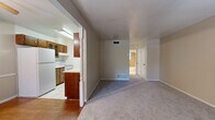 Located at 9310 Starcrest Drive in San Antonio, Texas, this single-story, one-bedroom, one-bathroom home offers a practical and well-organized layout. The open living area features neutral-toned carpet and connects seamlessly to the dining room, creating a comfortable shared space for everyday living. The kitchen is positioned adjacent to the dining area and is equipped with classic wood cabinetry, light countertops, a white range, a dishwasher, and a refrigerator, all set on easy-to-clean tile flooring. A decorative post column visually separates the kitchen and dining areas from the carpeted living space, adding a subtle architectural detail. The bedroom is a generously sized retreat with plush carpeting, a ceiling fan with light fixture, natural light from a window with blinds, and dual closets with bi-fold doors offering ample storage. The full bathroom features tile flooring, a tiled tub-and-shower combination, a toilet, and a vanity with storage. Additional highlights include a dedicated utility room, multiple closets throughout, and consistent ceiling fans providing comfort across the home.
