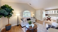 Located at 3001 Kodiak St in Antioch, CA, this thoughtfully designed 2-bedroom, 2-bathroom residence offers a comfortable and stylish single-floor layout. The living room immediately impresses with its vaulted ceilings, an arched window that fills the space with natural light, and a classic fireplace framed by a white mantel — creating a warm, inviting focal point. Hardwood-style flooring flows throughout the main living areas, complementing the neutral, soft-toned walls.

The galley-style kitchen is well-equipped with white shaker cabinetry, glass-front upper cabinets, granite countertops, and stainless steel appliances, offering both functionality and visual appeal. The adjacent dining area provides a seamless transition for everyday living and entertaining.

The spacious primary bedroom features large windows with garden views, vaulted ceilings, and a generous closet. The second bedroom is equally comfortable, with direct sightlines to the bright living area. Both bathrooms are finished with granite vanities and clean, neutral tilework, including a walk-in shower in one bath.

Additional highlights include multiple closets for ample storage, a utility room, hallways connecting each space efficiently, and a private balcony perfect for outdoor relaxation.