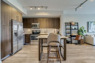 Counter on both sides of the electric range gives prep space to work. - South of Atlantic Luxury Apartments