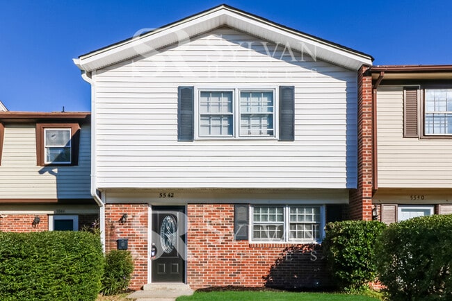 Building Photo - Venture outside to the expansive backyard,...