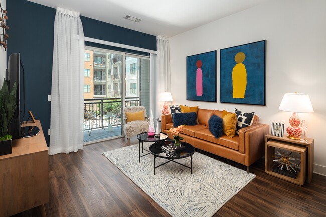 The navy wall wraps the balcony door and frames the seating below it. - 675 N. Highland