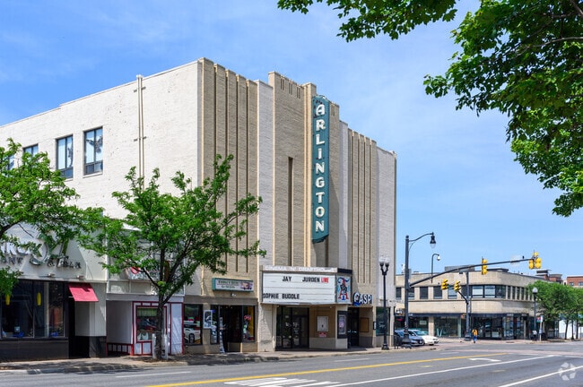 Watching a movie at the Arlington Cinema and Drafthouse, just minutes from Arlington Village.