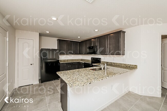Foto del edificio - 8409 Indian Laurel Lane