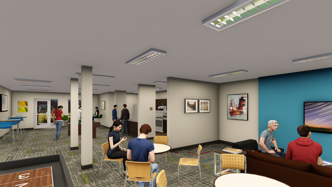 The private clubhouse at The Flats at WSU includes cable TVs, pool, foosball and other amenities. - The Flats at WSU