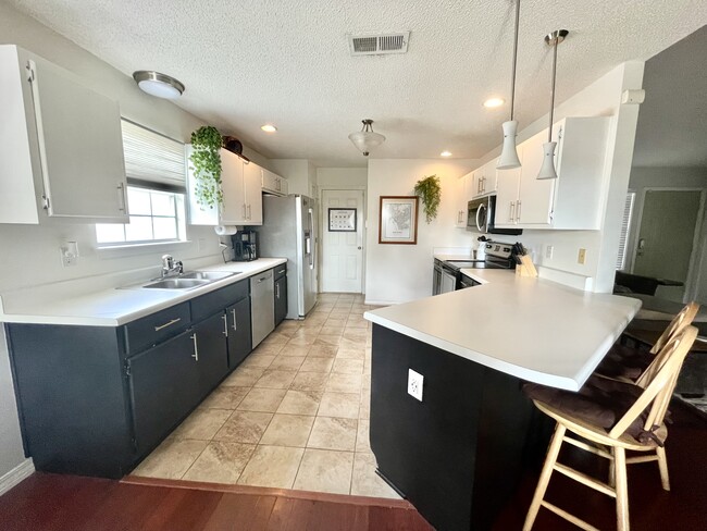 Kitchen with stainless steel applicances - 1502 Tommy Ln