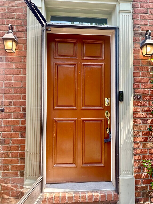 Front door with glass screen door, number pad key entry, nest doorbell - 2312 18th Ave S