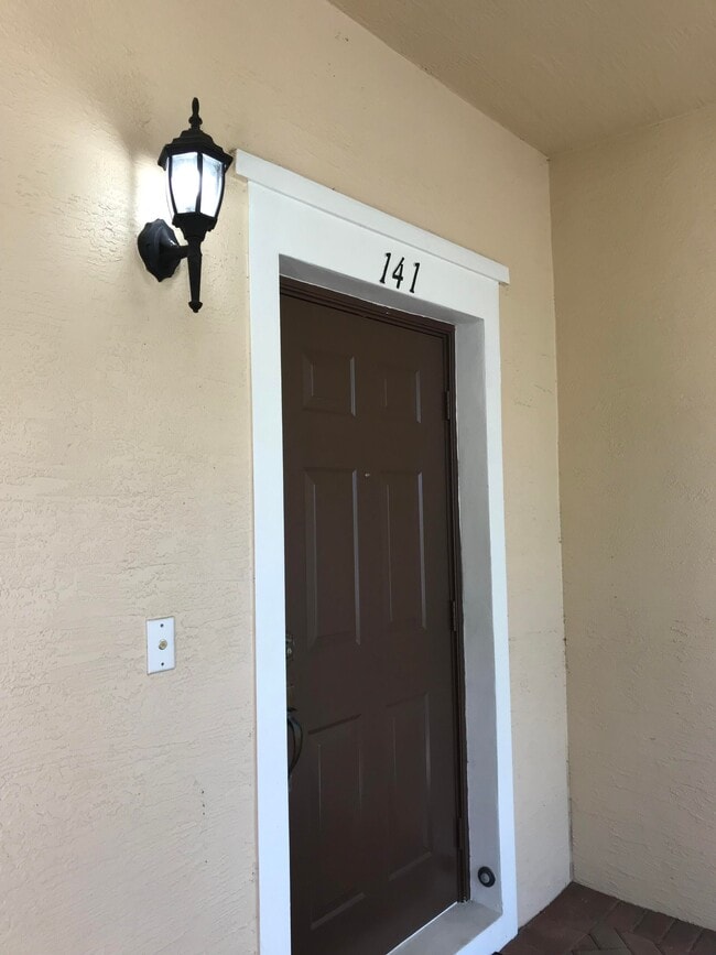 Photo - 141 E Thatch Palm Cir Townhome