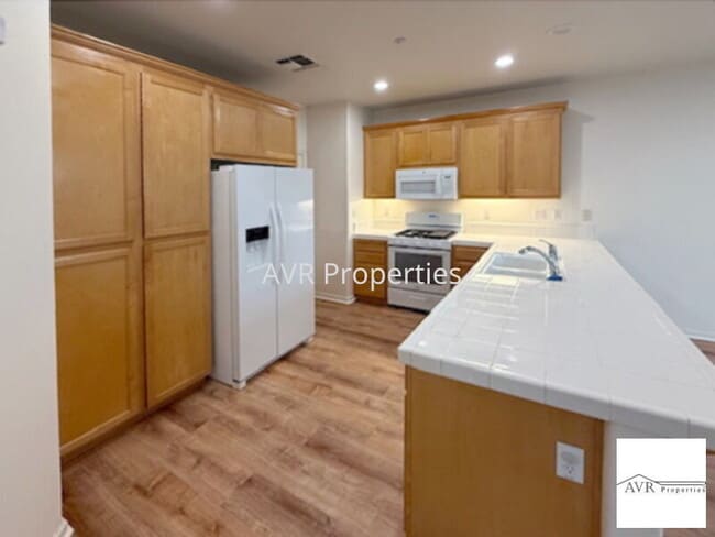 Building Photo - Spacious home with a large open concept kitchen, dining and living room