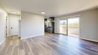 Located at 35 Rosarita Dr in Salinas, CA, this thoughtfully updated single-story home offers a clean, modern aesthetic throughout its efficiently designed layout. The open living area welcomes you with light wood-style plank flooring, neutral gray walls, and a front entry door with a sidelight window that brings in natural light. Sliding glass doors lead directly to a private balcony, extending the living space outdoors with open views of the surrounding neighborhood.

The galley-style kitchen is a standout feature, showcasing slate-blue shaker cabinetry with matte black hardware, quartz countertops, a stainless steel undermount sink, and stainless steel appliances including a refrigerator and range — all complemented by light wood-tone flooring that brightens the space.

The bedroom is a comfortable, well-proportioned room featuring wood-style flooring, soft gray walls, a window with slatted blinds that allows for natural light and outdoor views, and a mirrored sliding-door closet that adds depth and functionality.

The bathroom continues the modern design language with a gray vanity, quartz countertop, undermount sink, and light wood-style flooring, all set against clean white walls for a crisp, contemporary finish.