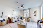 This 1-bedroom, 2-bathroom residence delivers a smart and efficient layout across a single floor, combining modern design with comfortable living. The entrance features a built-in shiplap drop zone with wall hooks, setting a welcoming and organized tone from the moment you arrive. Light hardwood-style flooring flows through the main living areas, creating a seamless, cohesive aesthetic throughout.

The open-concept kitchen is equipped with stainless steel appliances, white upper cabinetry, contrasting gray lower cabinets, granite countertops, and a peninsula with pendant lighting — ideal for both everyday cooking and casual dining. The kitchen connects naturally to a bright living room featuring a ceiling fan, large windows with outdoor views, and access to a private balcony, flooding the space with natural light.

The bedroom offers carpeted flooring, generous window exposure, and direct access to a walk-in closet outfitted with wire shelving and hanging rods. The primary bathroom includes white cabinetry, dark granite countertops, and direct closet access. A second bathroom provides additional convenience. A hallway nook accommodates a dedicated workspace or reading area, rounding out this efficiently designed and stylish residence.