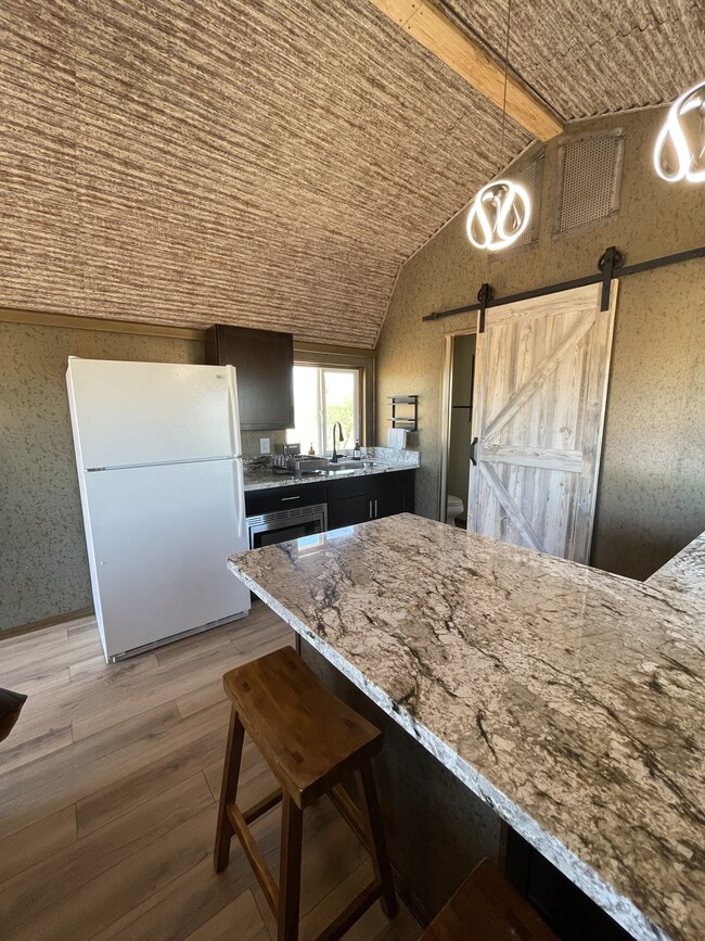 Kitchen with full size fridge. - 8405 N Via Socorro