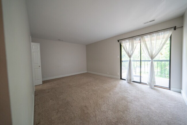 HUGE master bedroom. Doors open up to porch area. - 5482 S Springtree Ln