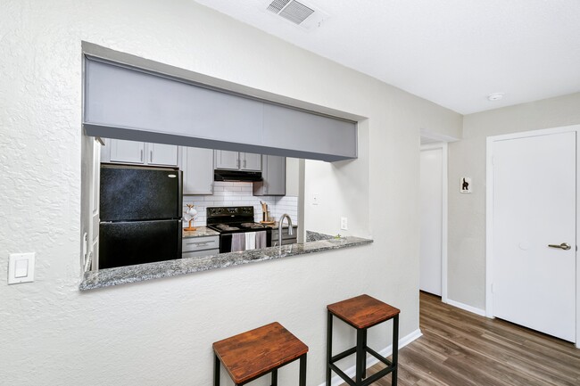 Kitchen with Breakfast Bar - Timberlake Apartments