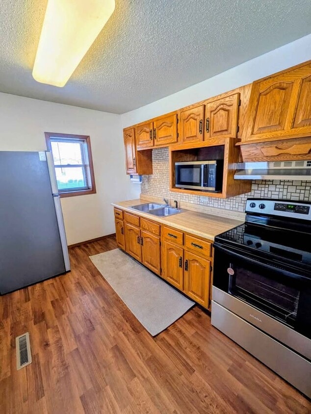 New stainless steel appliances - 1426 E 17th St